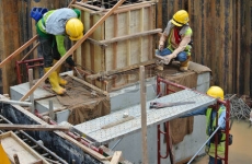 43862468-construction-workers-installing-the-pile-cap-and-column-stump-formwork-at-the-construction-site-in-s